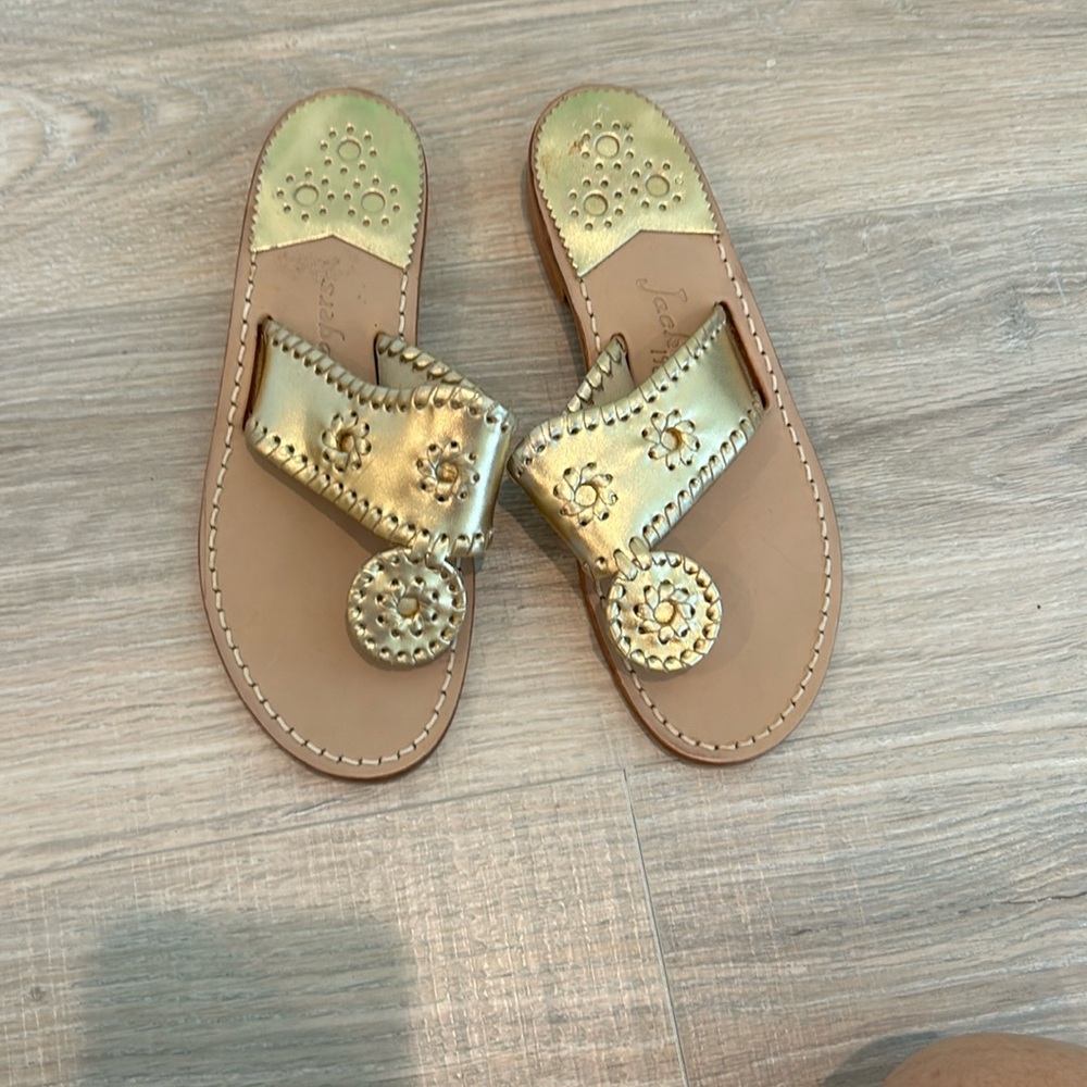 Jack Rogers gold sandals.